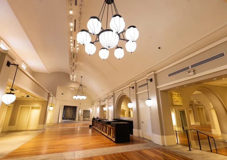 The interior of the Coliseum Theatre today, with a drop ceiling and retail-era walls hiding the original 1916 cathedral above