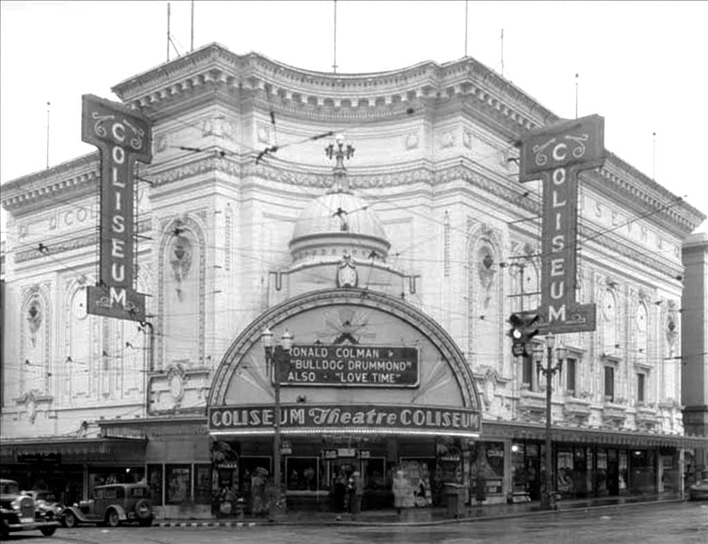 The Coliseum Theatre, Pike Street and 5th Avenue, Seattle, photographed in 1934 with the original vertical COLISEUM signs and the Beaux-Arts white terra-cotta facade